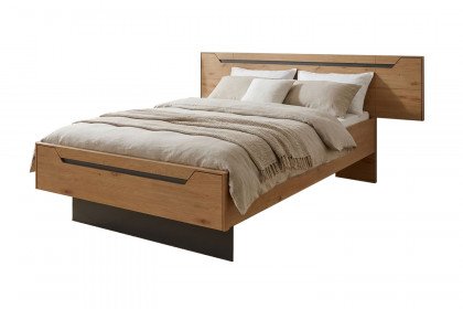 Incasa Onema von Decker - Massivholzbett mit breitem Kopfteil Wildeiche geölt