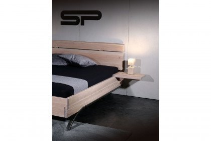 Arcobello von Sprenger Möbel - Holzbett mit schwarz patinierten Bogenfüßen aus Eisen
